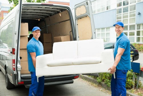 Man with van loading furniture for a move in West Hampstead