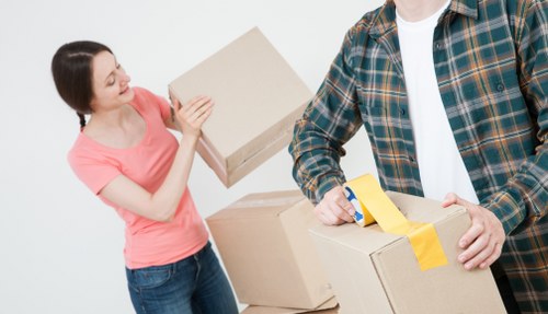 Careful loading of household items in a West Hampstead street