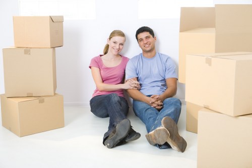 Professional movers handling office furniture during a local relocation
