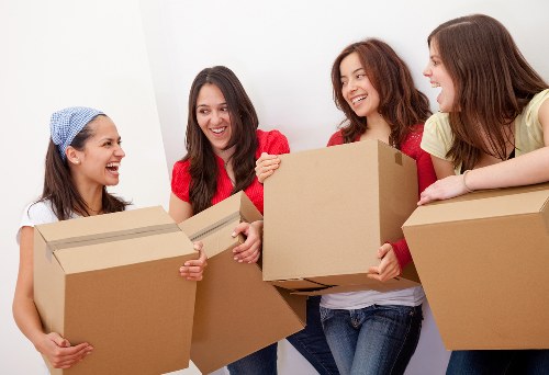 Professional movers handling a flat move on a London street