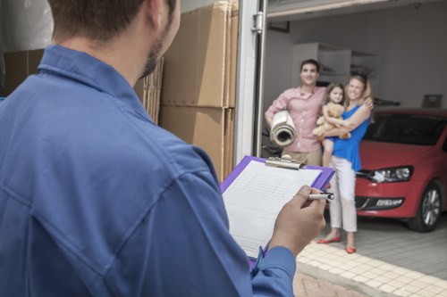 Professional movers transporting sofas and home furniture in West Hampstead