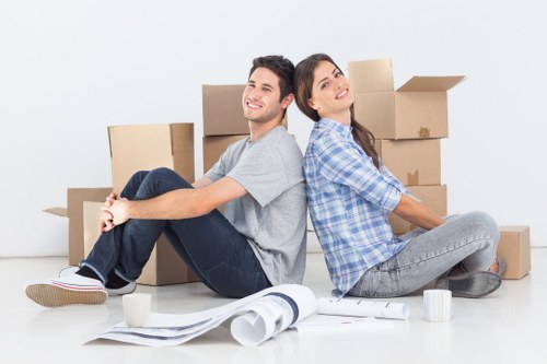 Packed moving boxes and furniture in a West Hampstead flat