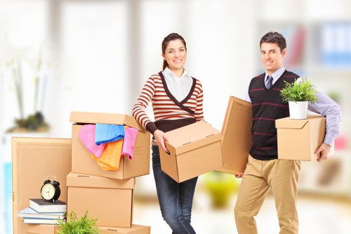 Boxes and household items being carried into a West Hampstead property
