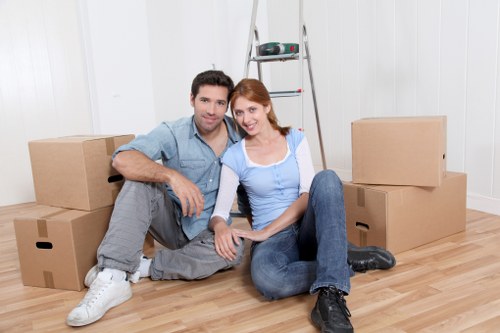 Removal team preparing items and boxes for transport
