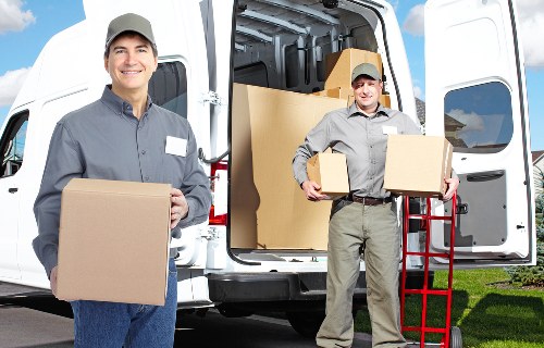Trained removal staff handling items safely with PPE
