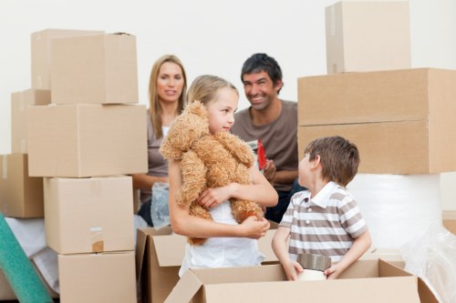 Local movers preparing boxes and furniture for transport